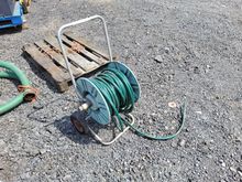 Image of Garden Hose Pipe On Wheels
