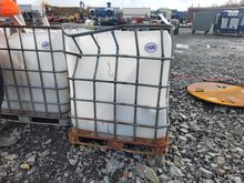 Image of IBC Tank With Various Brands of Oil Filters, Air Filters and Fuel Filters