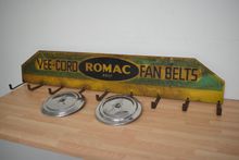 Image of Romac Fan Belt display and Austin 10-12 hubcaps