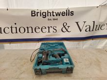 Image of Milwaukee Combi Drill + Makita Fix Nail Gun