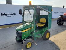 Image of John Deere X320 Cabbed Compact Tractor
